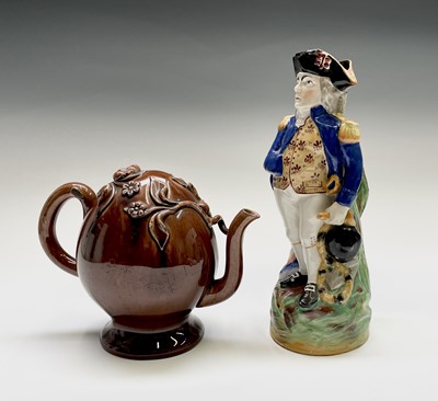 Lot 925 - A Staffordshire pottery character jug, late...
