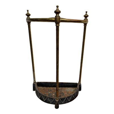 Lot 138 - A cast iron and brass half round umbrella stand.