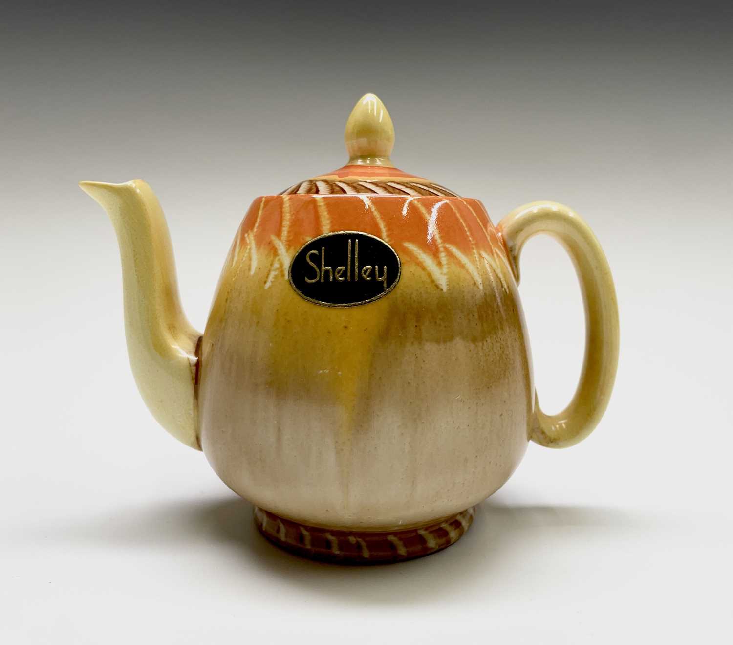 Lot 929 - A 1930s Shelley drip ware teapot, with...