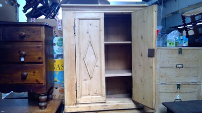 Lot 142 - A Victorian pine cupboard, the pair of...