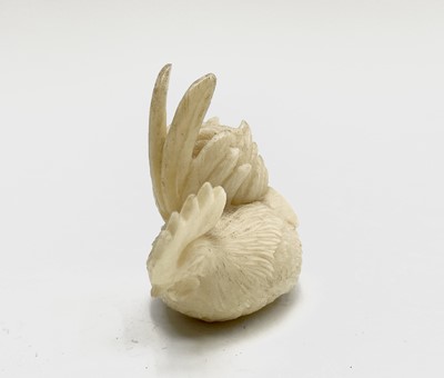 Lot 181 - A carved ivory rooster 40mm high and two horn...