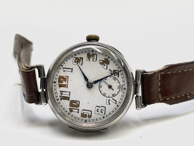 Lot 233 - A collection of eleven trench watches.