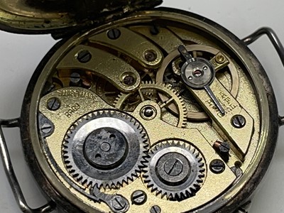 Lot 233 - A collection of eleven trench watches.
