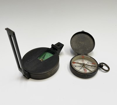 Lot 548 - A lacquered brass cased pocket compass, by...