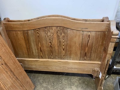 Lot 146 - A French pitch pine bed, height 96cm, length...