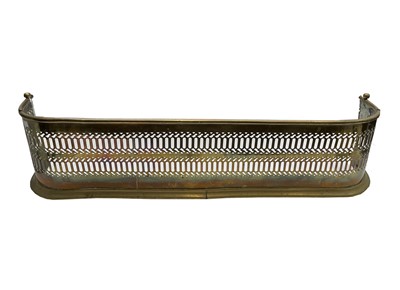 Lot 209 - A Victorian brass fender, with pierced...