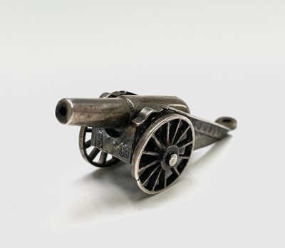 Lot 145 - A Chinese silver miniature model of a canon, a...