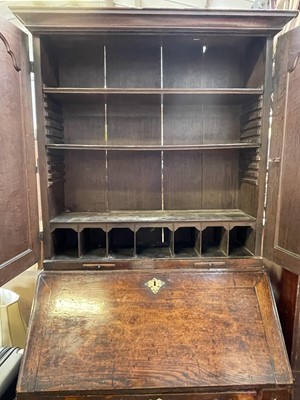 Lot 26 - A George III oak bureau bookcase, with a pair...