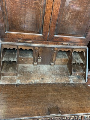 Lot 26 - A George III oak bureau bookcase, with a pair...