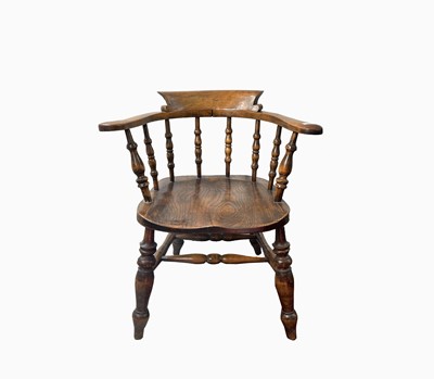Lot 148 - An ash and beech smokers bow armchair, stamped...