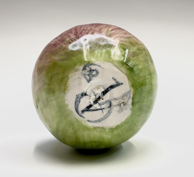 Lot 956 - A porcelain sculpture of an apple modelled by...