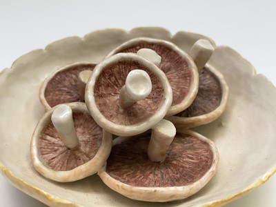 Lot 954 - A porcelain sculpture of mushrooms in a bowl...