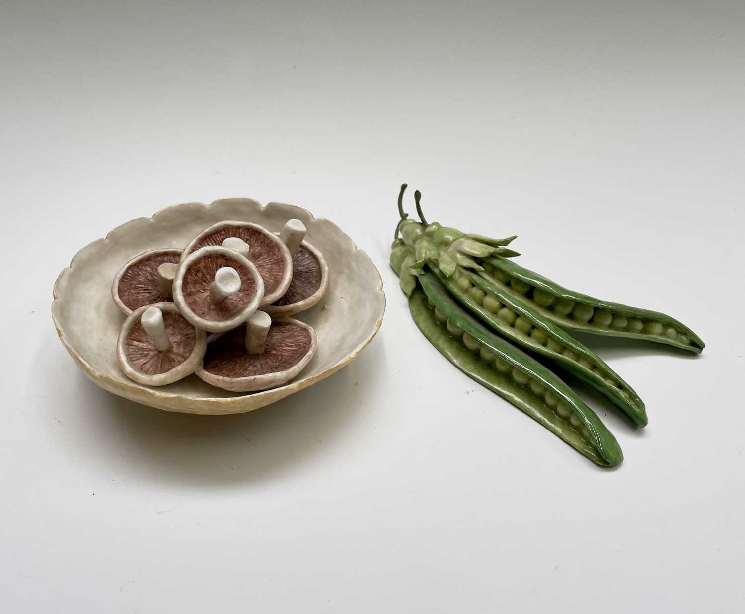 Lot 954 - A porcelain sculpture of mushrooms in a bowl...