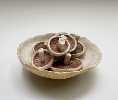 Lot 954 - A porcelain sculpture of mushrooms in a bowl...