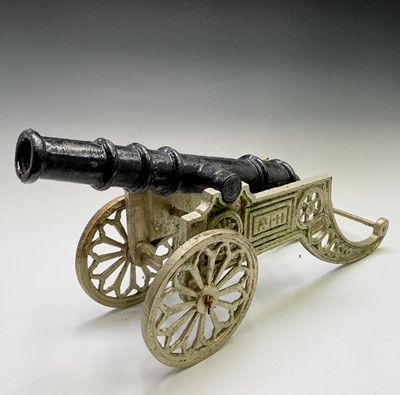 Lot 259 - A pair of decorative cast iron model cannon,...
