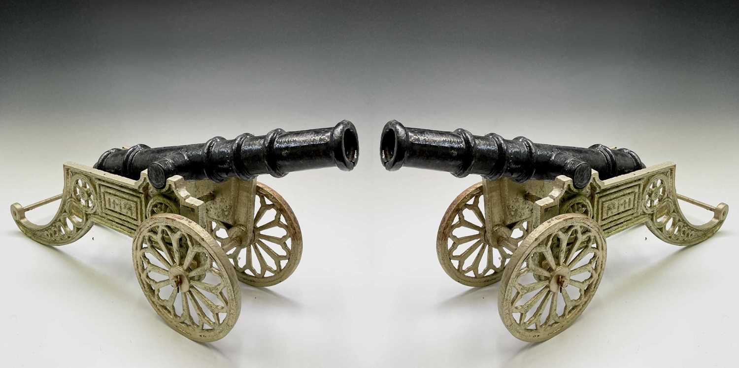 Lot 259 - A pair of decorative cast iron model cannon,...