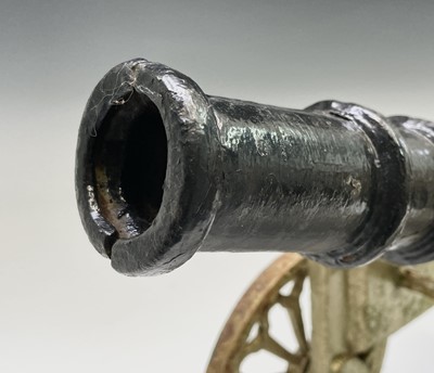 Lot 259 - A pair of decorative cast iron model cannon,...