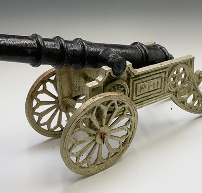 Lot 259 - A pair of decorative cast iron model cannon,...