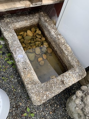 Lot 406 - A large granite trough of rectangular form....