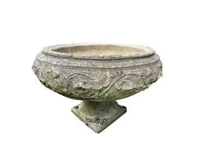 Lot 609 - A reconstituted stone planter of circular font...