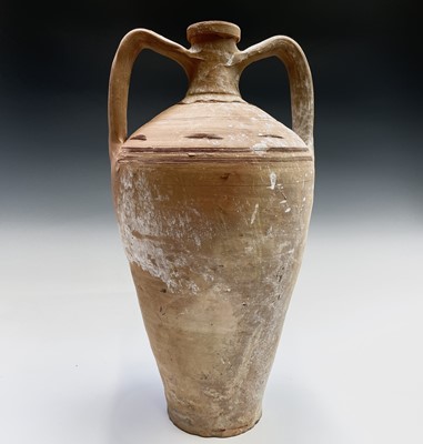 Lot 342 - A twin handled terracotta jar with incised...