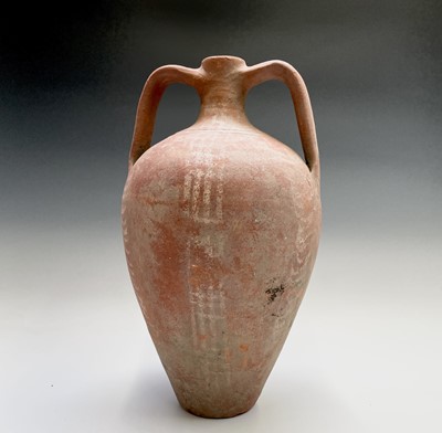 Lot 343 - A twin handled terracotta jar with red washed...