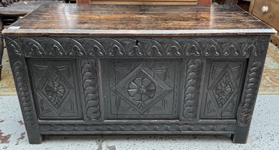 Lot 570 - A 17th century carved oak coffer, with a later...