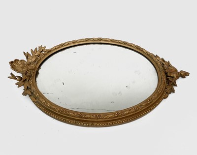 Lot 3016 - A Victorian oval gilt wall mirror, the gesso...