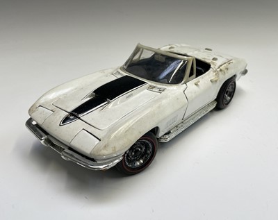 Lot 125 - A Burago diecast 1957 Chevrolet, together with...