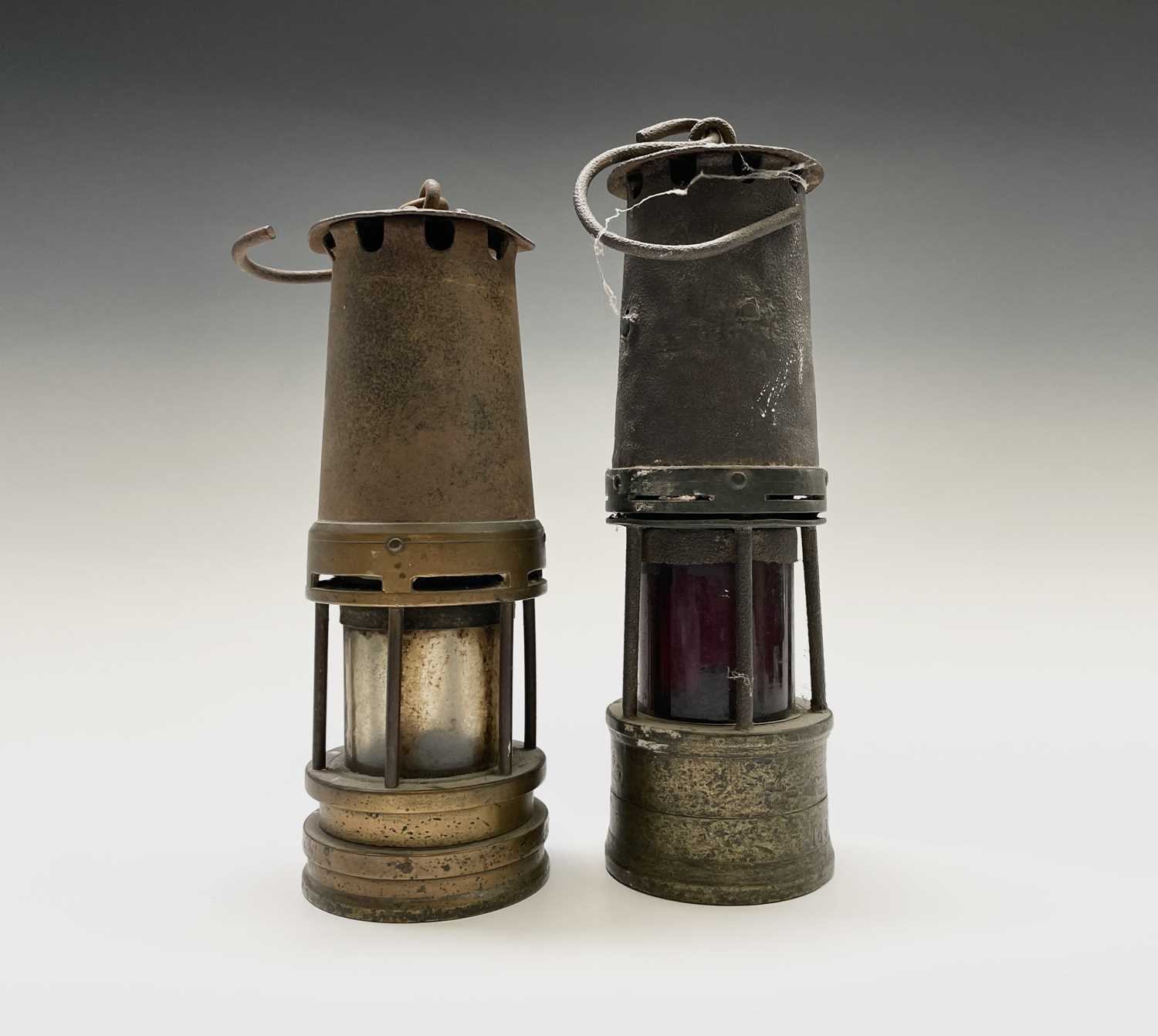 Lot 300 - Two 19th century brass and steel miners lamps,...