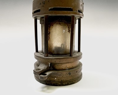 Lot 300 - Two 19th century brass and steel miners lamps,...