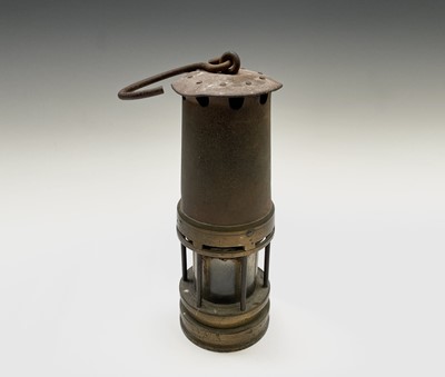 Lot 300 - Two 19th century brass and steel miners lamps,...