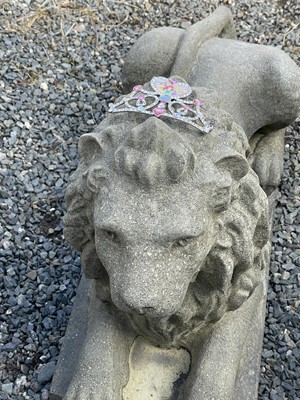 Lot 650 - A large pair of reconstituted stone recumbent...