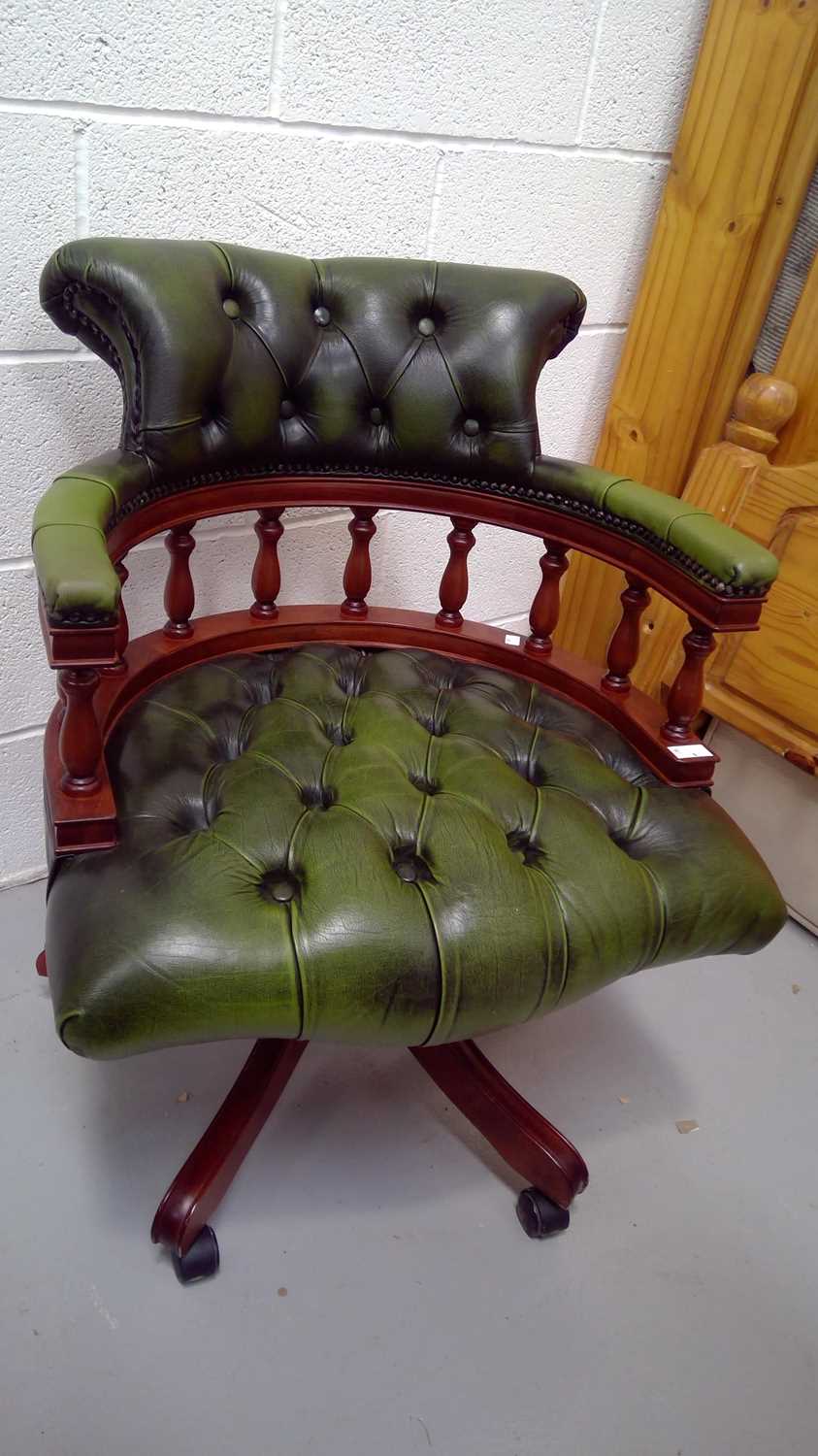 Lot 1 A Centurion furniture green leather captain's