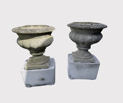 Lot 603 - A pair of composition garden urns on...