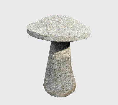 Lot 607 - A composition stone staddle stone. Height 62cm.