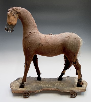 Lot 304 - A late Victorian pull-along toy horse, fabric...