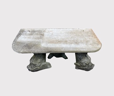 Lot 600 - A garden bench, a marble slab raised on three...