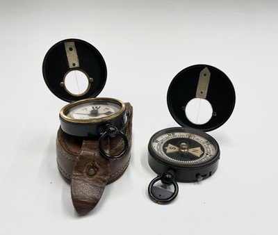 Lot 556 - A black lacquered brass night marching compass,...