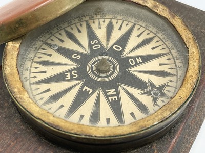 Lot 565 - A Victorian brass pocket compass, with...