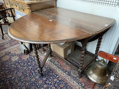 Lot 3192 - An oak barley twist gateleg dining table,...