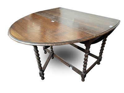 Lot 3093 - An oak barley twist gateleg dining table,...