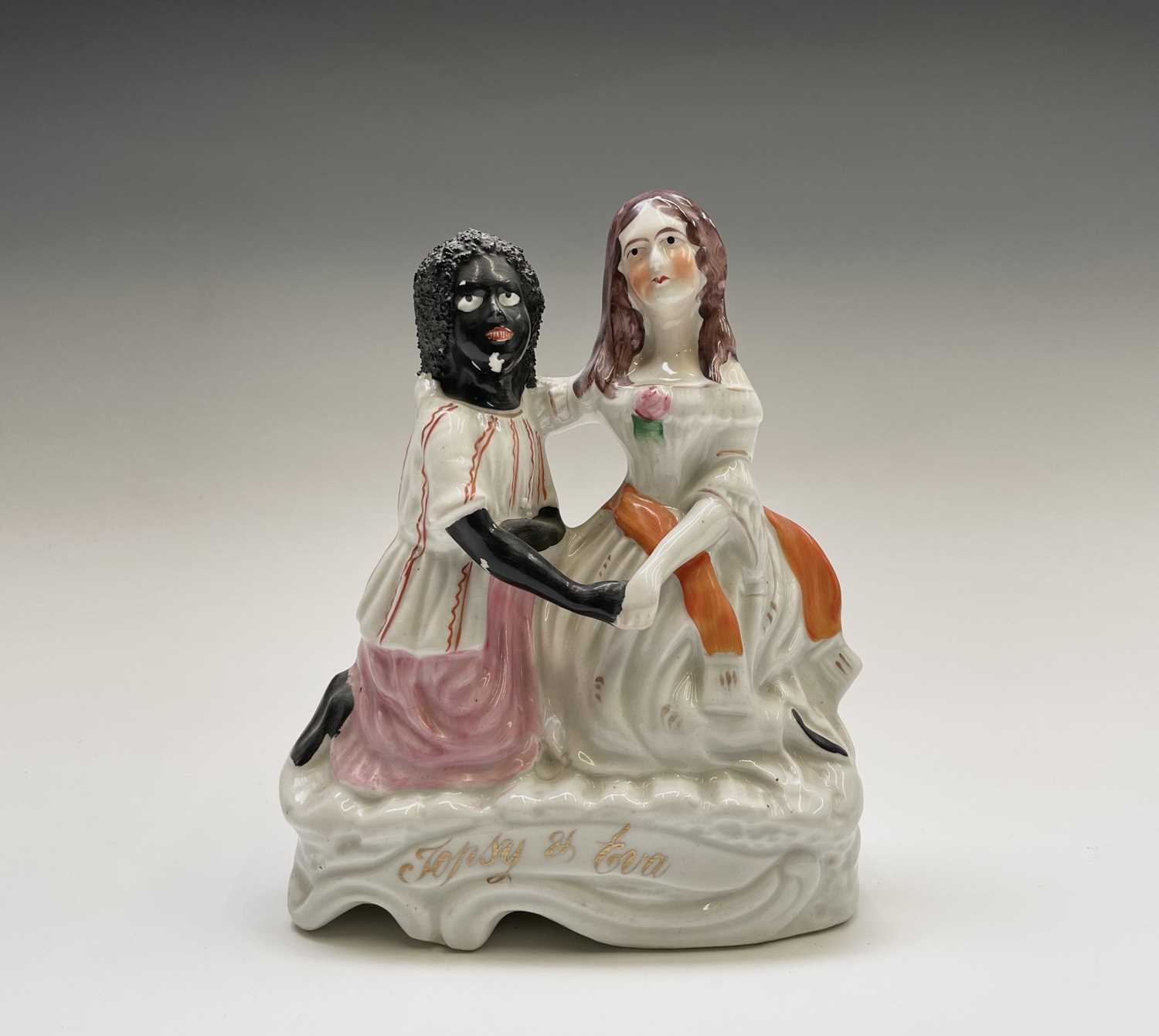 Lot 968 - A Staffordshire figure of Topsy and Eva, circa...