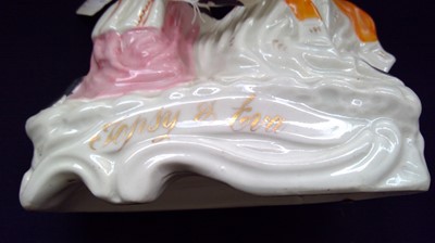 Lot 968 - A Staffordshire figure of Topsy and Eva, circa...