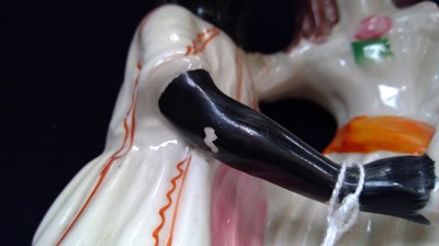 Lot 968 - A Staffordshire figure of Topsy and Eva, circa...