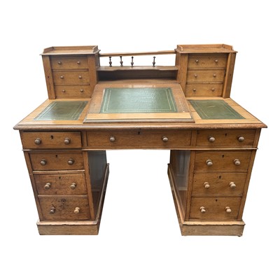 Lot 3387 - A Victorian light oak twin pedestal desk, the...