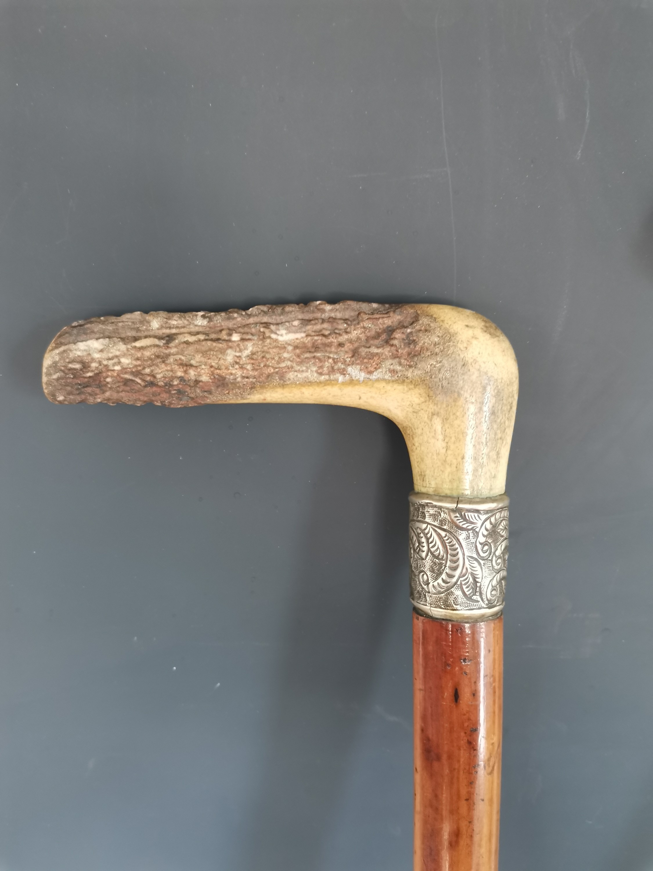 Lot 192 An antique horse measuring walking cane, two
