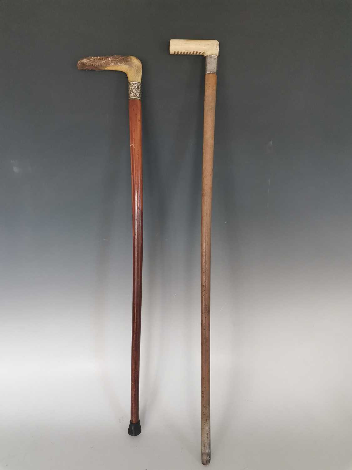 Lot 192 An antique horse measuring walking cane, two