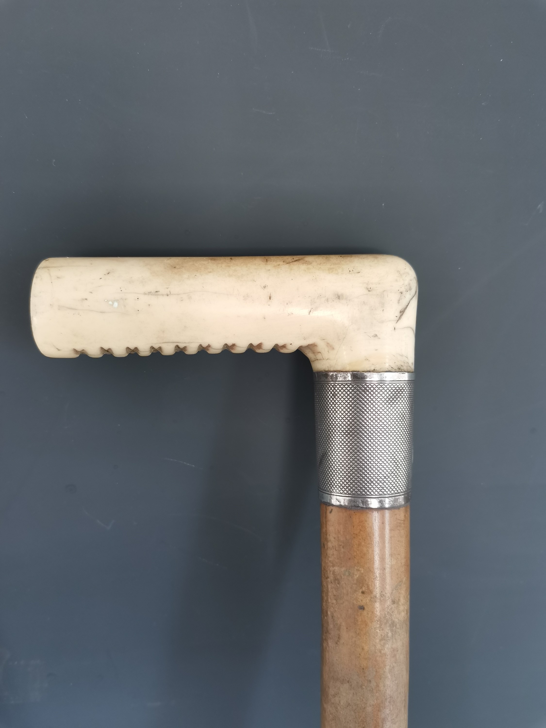 Lot 192 An antique horse measuring walking cane, two