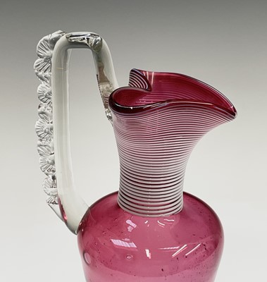 Lot 975 - A Victorian cranberry glass vase with white...